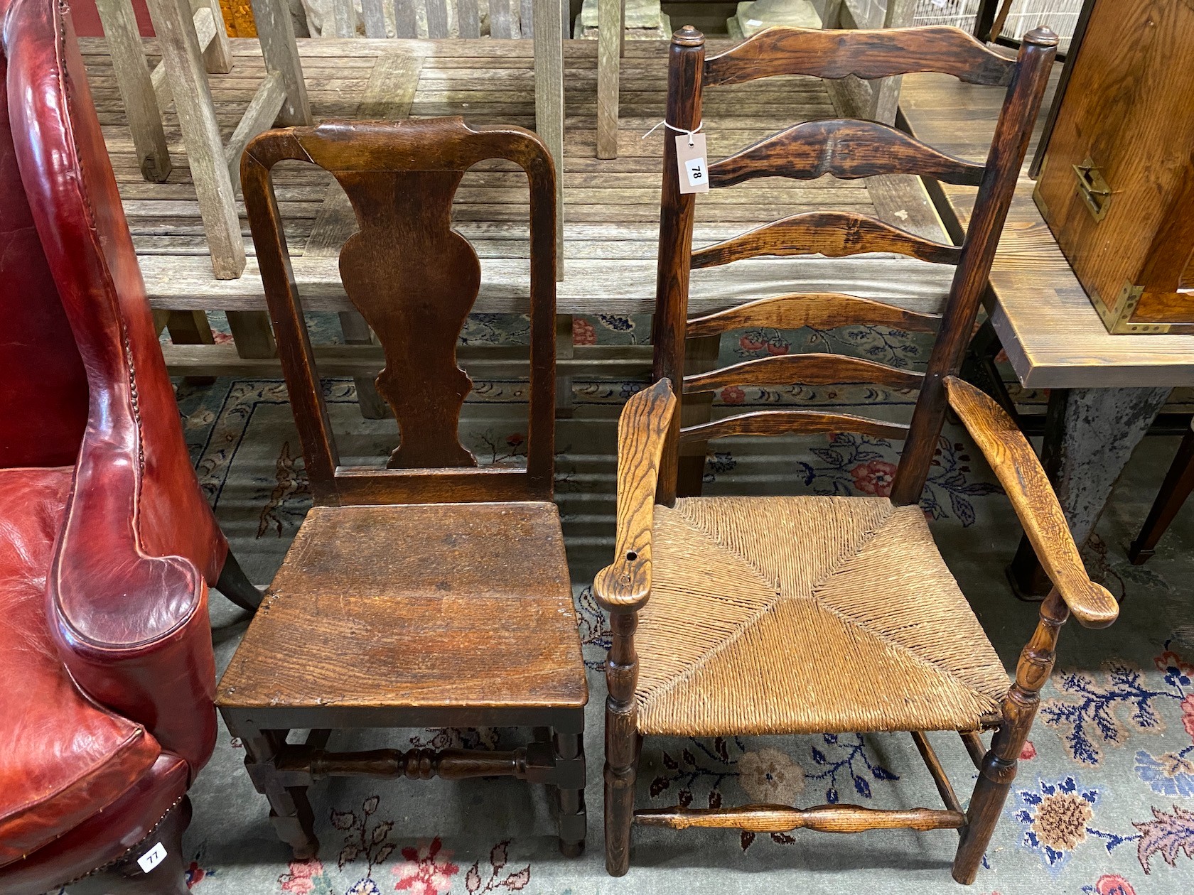 A 19th century ash and elm rush seat ladderback elbow chair, height 109cm together with an 18th century oak wood seat chair